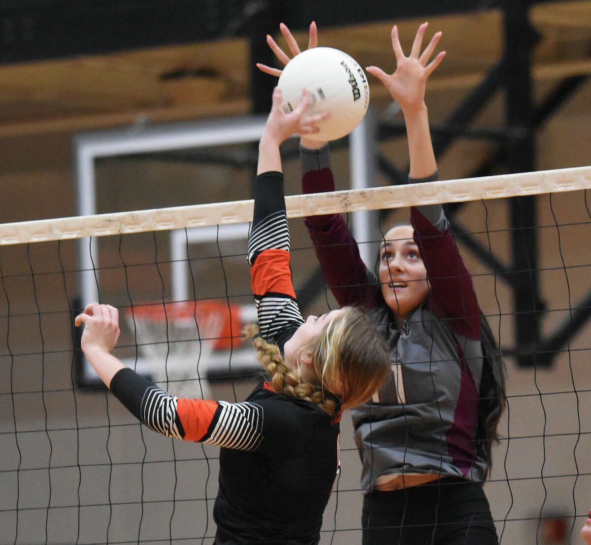 Edwardsville's Megan Knobeloch tries to tip a ball over the net against Belleville West on Thursday in the Class 4A Edwardsville Regional championship match inside Lucco-Jackson Gymnasium in Edwardsville.