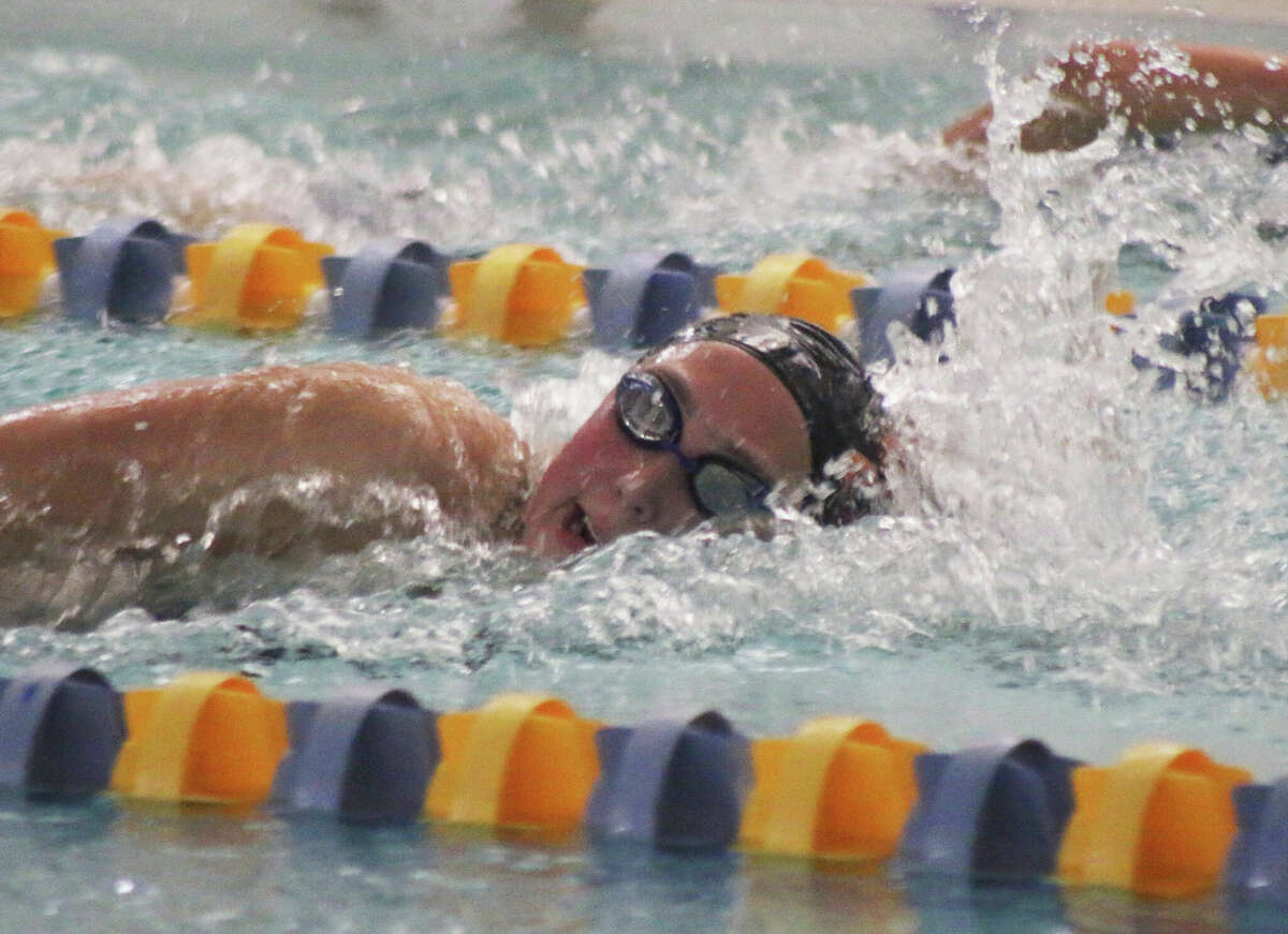 Maddie Milburn swims against O'Fallon on Thursday at the O'Fallon YMCA. 