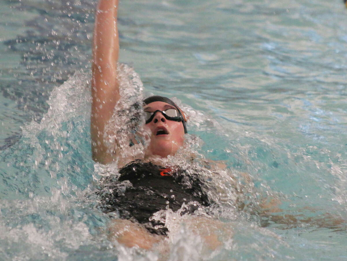 Grace Oertle swims against O'Fallon on Thursday at the O'Fallon YMCA. 