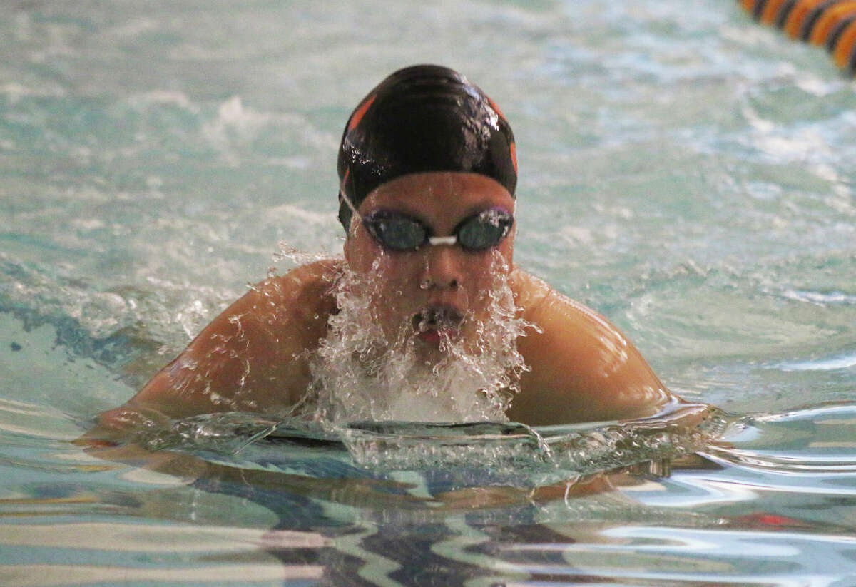 Karis Chen swims against O'Fallon on Thursday at the O'Fallon YMCA. 