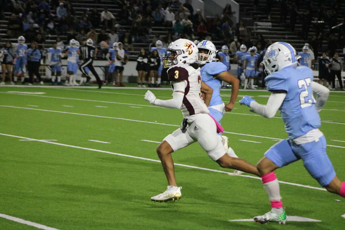 Deer Park's Joshua Mendoza races past some Rayburn defenders en route to a big pass play that set up the team's fourth touchdown in the first quarter Thursday night.
