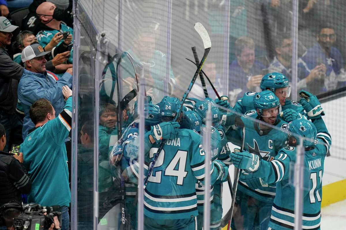 The San Jose Sharks celebrate after the winning score by defenseman Erik Karlsson during the overtime period of an NHL hockey game against the Toronto Maple Leafs in San Jose, Calif., Thursday, Oct. 27, 2022. (AP Photo/Godofredo A. Vásquez)