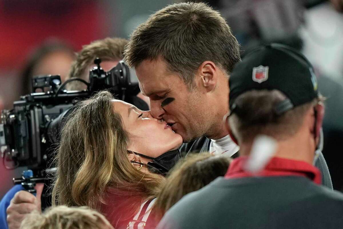 FILE - Tampa Bay Buccaneers quarterback Tom Brady kisses wife Gisele Bundchen after defeating the Kansas City Chiefs in the NFL Super Bowl 55 football game Sunday, Feb. 7, 2021, in Tampa, Fla. The Buccaneers defeated the Chiefs 31-9 to win the Super Bowl. The couple announced Friday they have finalized their divorce, ending their 13-year marriage.
