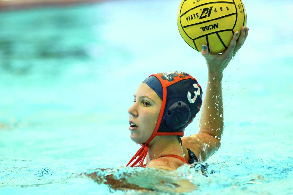 Brandeis’ Grace Goldhammer passes the ball during the third period of Saturday’s 6A Region IV water polo regional semi final match against Harlingen at the Southwest ISD Aquatic Center.