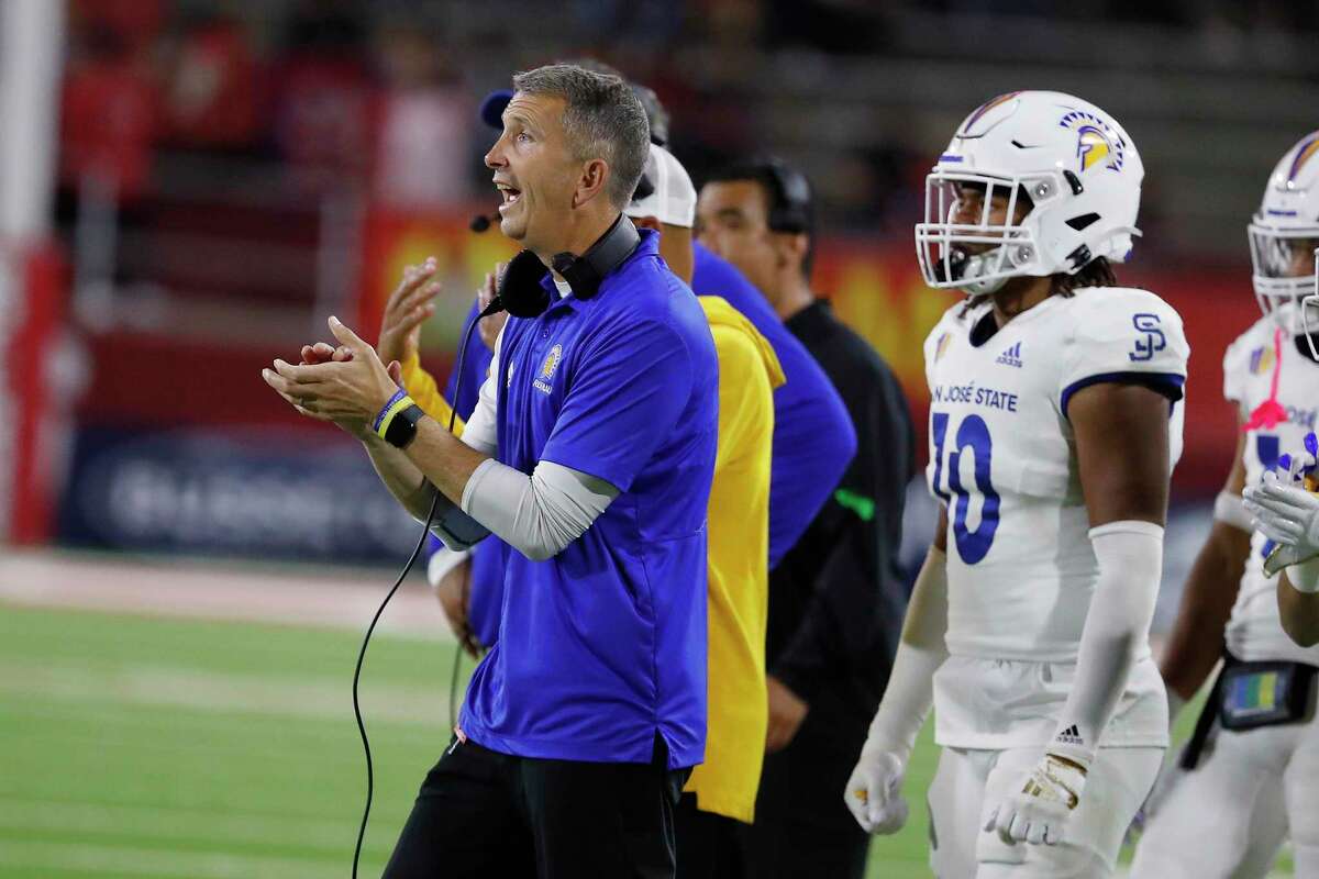 San Jose State coach Brent Brennan chears on his team against Fresno State during the second half of an NCAA college football game in Fresno, Calif., Saturday, Oct. 15, 2022. (AP Photo/Gary Kazanjian)