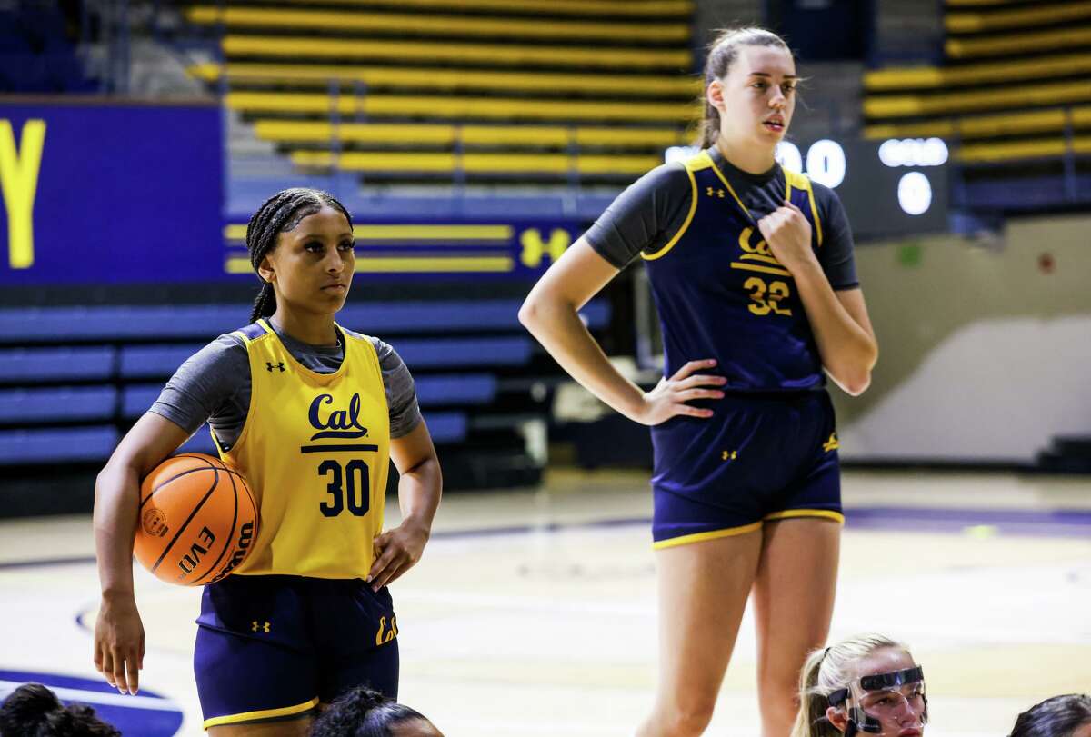 Guard Jayda Curry (30) stands near teammates as they listen to head coach Charmin Smith, not pictured, speak during the women?•s basketball practice at Haas Pavilion at the University of California, Berkeley on Wednesday, October 26, 2022, in Berkeley, Calif.