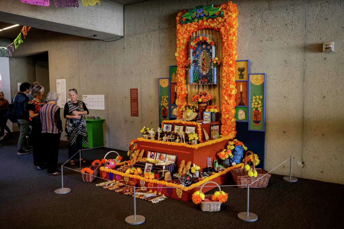 An altar, known as an ofrenda, brings awareness to young victims of school shootings during the 28th annual Día de los Muertos celebration at the Oakland Museum of California.