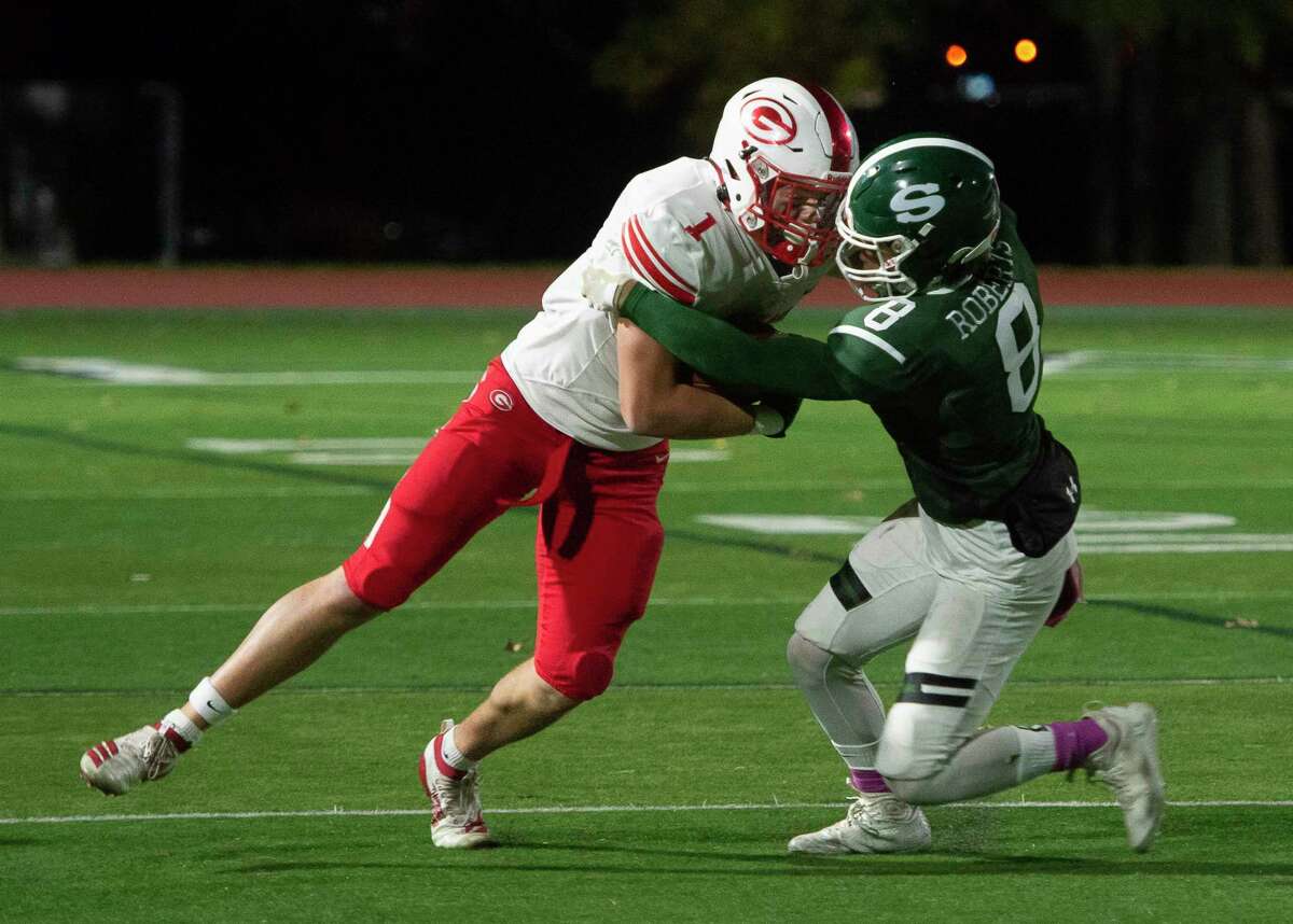 Shenendehowa defensive back Eric Roberts tackles the ball carrier, Guilderland tight end Troy Berschwinger during a game in Clifton Park on Friday, Oct. 28, 2022. (Jenn March, Special to the Times Union)