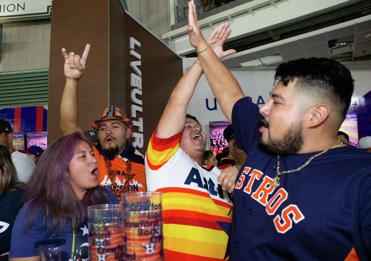 Houston Astros fans Vanessa and Manuel Rojas rally with Joe Hernandez and Henry Gomez during Game 1 of World Series against Philadelphia Phillies Friday, Oct. 28, 2022, at Minute Maid Park in Houston.