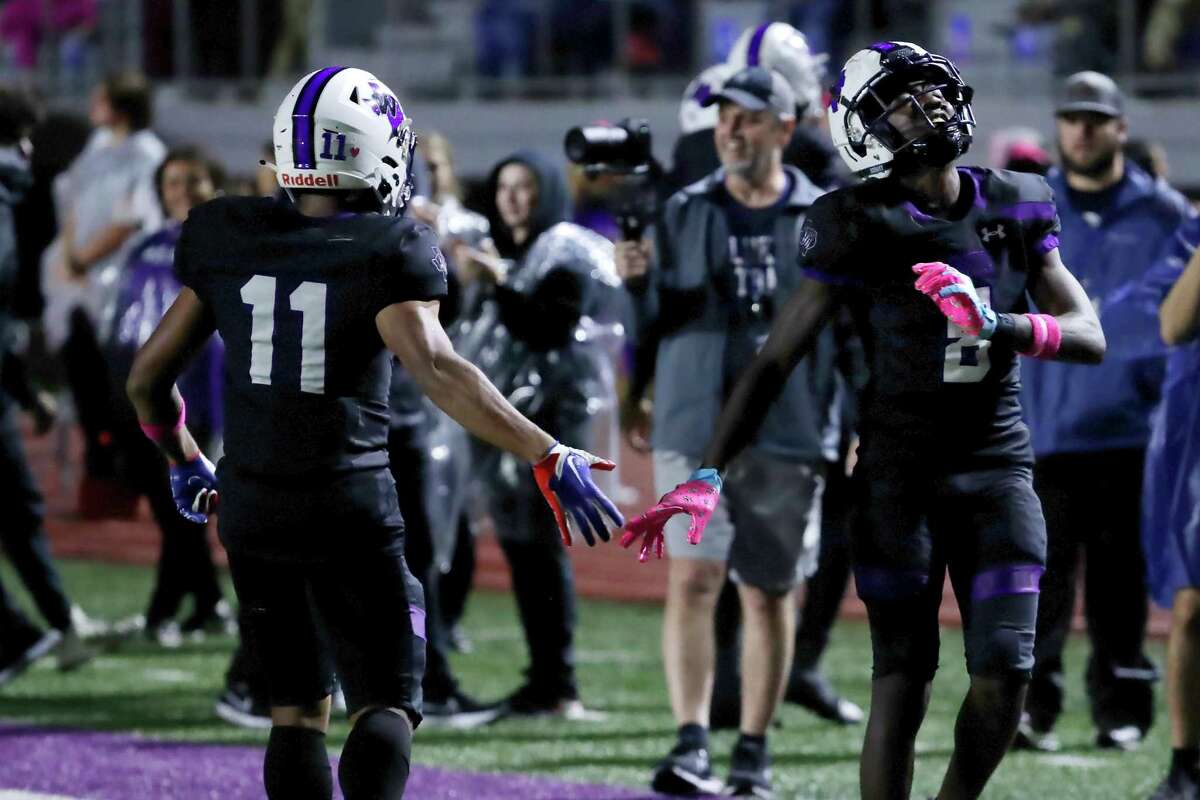 Willis' Jalen Mickens (11) and Debraun Hampton, right, celebrate the touchdown by Hampton against The Woodlands during the first half of their District 13-6A high school football game held at Berton A. Yates Stadium Friday, Oct. 28, 2022 in Willis, TX.