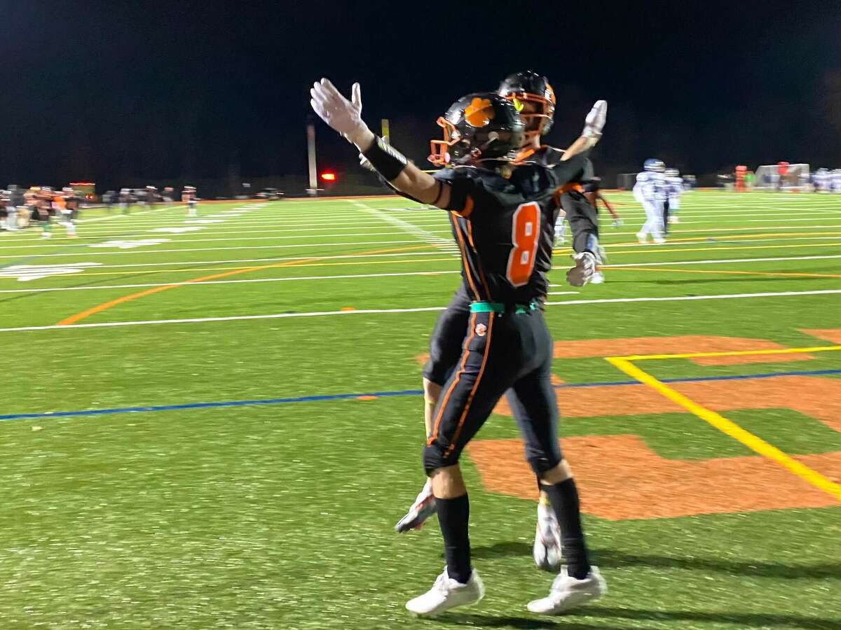 Ridgefield's Jude Vucci celebrates after catching a touchdown pass against Wilton on Friday, Oct. 28, 2022.