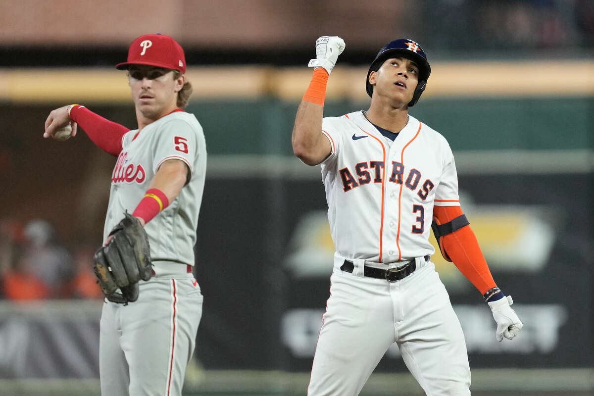 Houston Astros Jeremy Pena (3) reacts beside Philadelphia Phillies shortstop Bryson Stott (5) after hitting a double off Philadelphia Phillies starting pitcher Aaron Nola in the third inning during Game 1 of the World Series at Minute Maid Park on Friday, Oct. 28, 2022, in Houston.