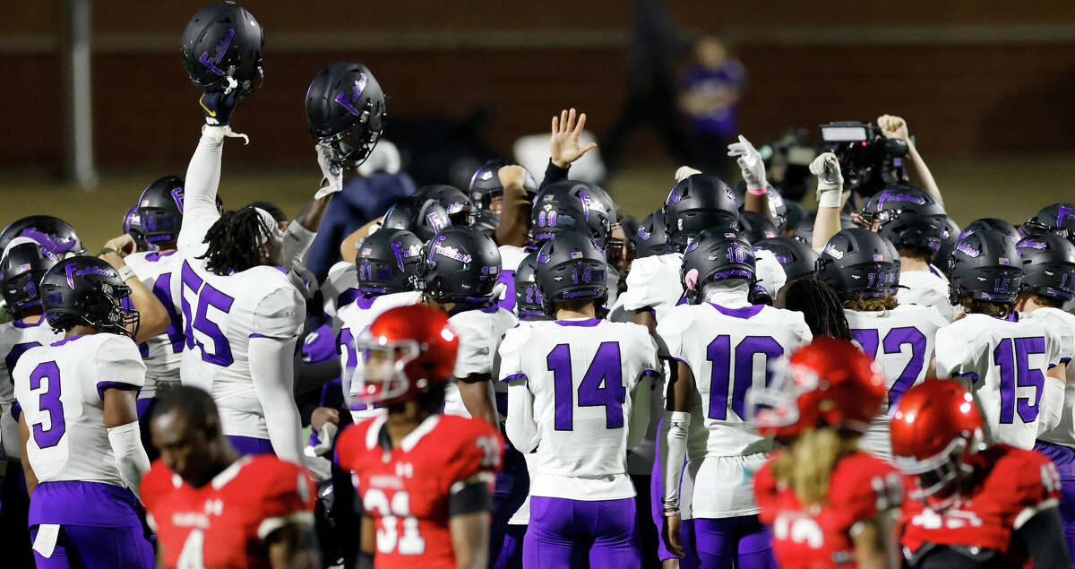 The Fulshear Chargers celebrate as the Manvel Mavericks walk off the field after the high school football game between the Manvel Mavericks and the Fulshear Chargers at Freedom Field in Rosharon, TX on Friday, October 28, 2022. Fulshear defeated Manvel 9-7.