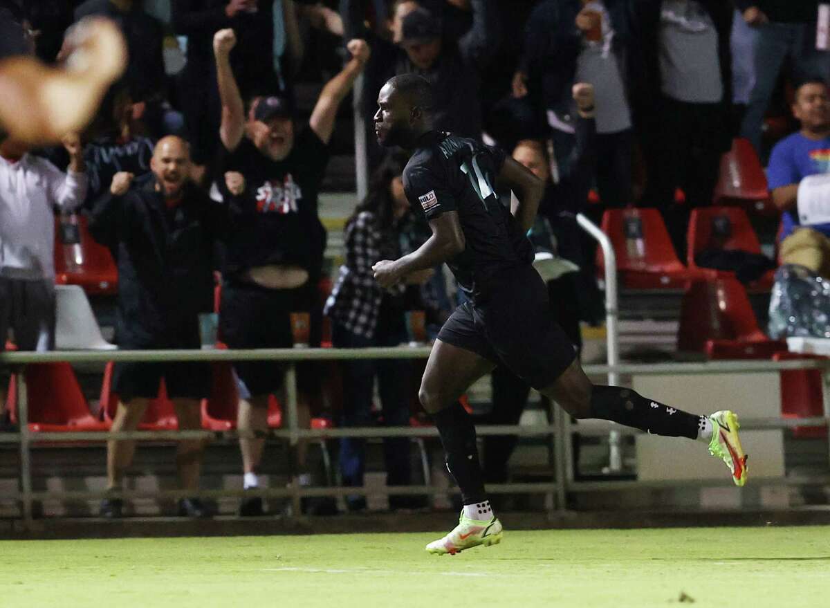 Fans celebrate a goal by San Antonio FC’s Samuel Adeniran (14) against the Oakland Roots at two minutes during their soccer game in the first round of the playoffs at Toyota Field on Friday, Oct. 28, 2022.
