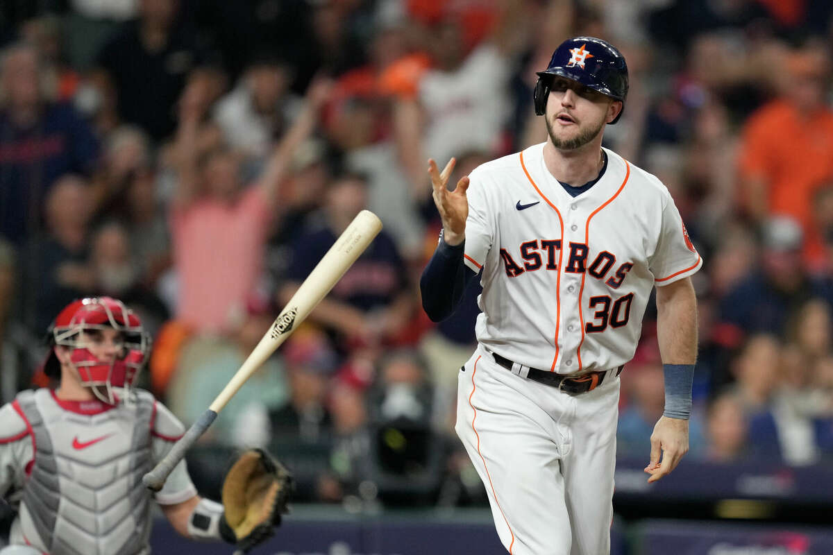 Houston Astros Kyle Tucker (30) tosses his bat after hitting a solo home run off Philadelphia Phillies starting pitcher Aaron Nola in the second inning during Game 1 of the World Series at Minute Maid Park on Friday, Oct. 28, 2022, in Houston.