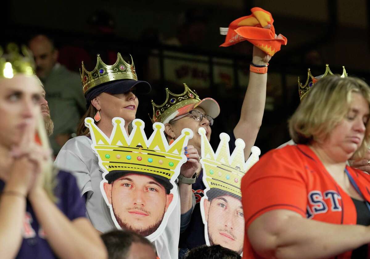 Stephanie Concialdi and Amber Stoltz rallying while wearing special crowns as a tribute to Kyle Tucker during Game 1 of World Series Friday, Oct. 28, 2022, at Minute Maid Park in Houston.