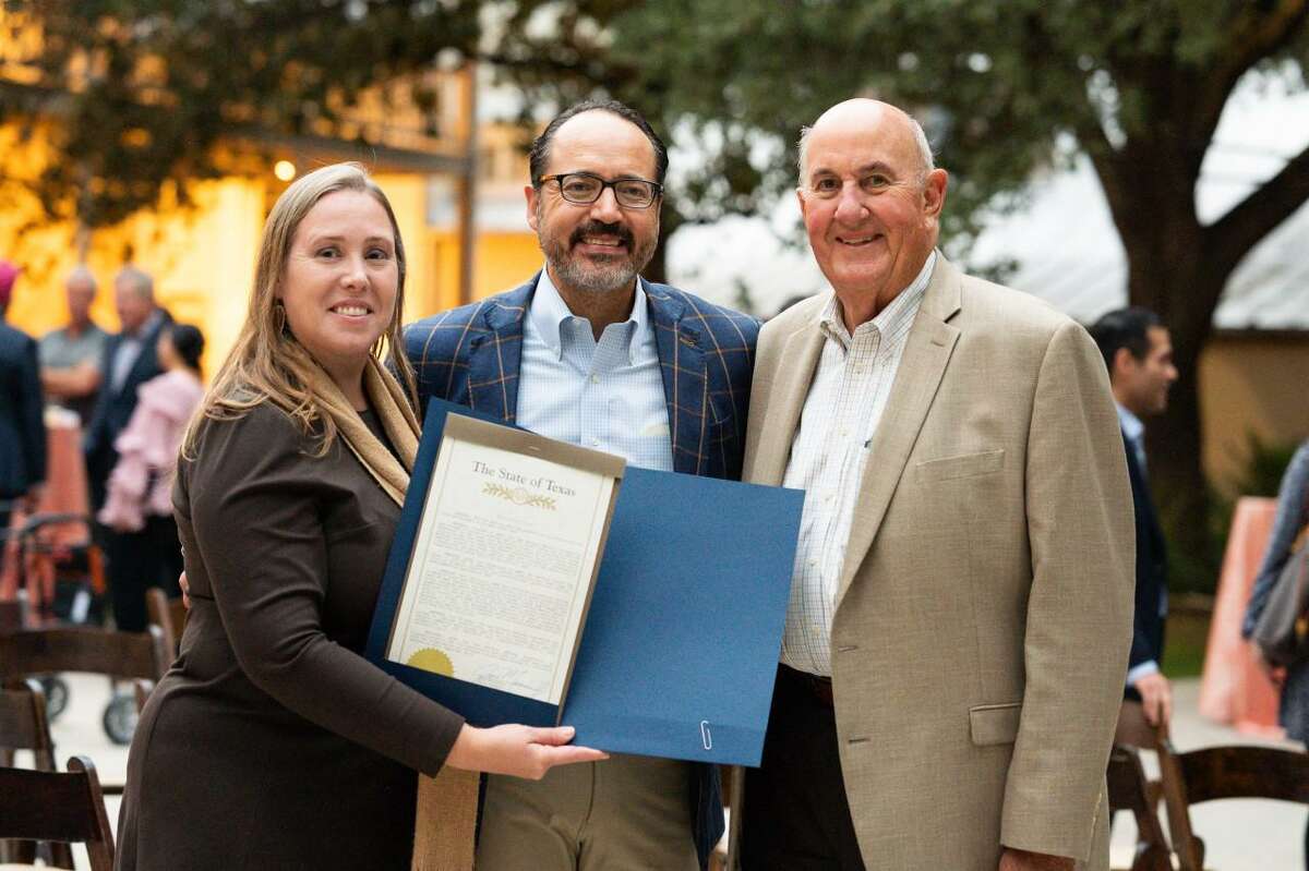 State Sen. José Menéndez, center, presents a authorities   proclamation congratulating the San Antonio Medical Foundation connected  its 75th day  to its committee  chair, Stephanie Chandler, and president, Jim Reed.