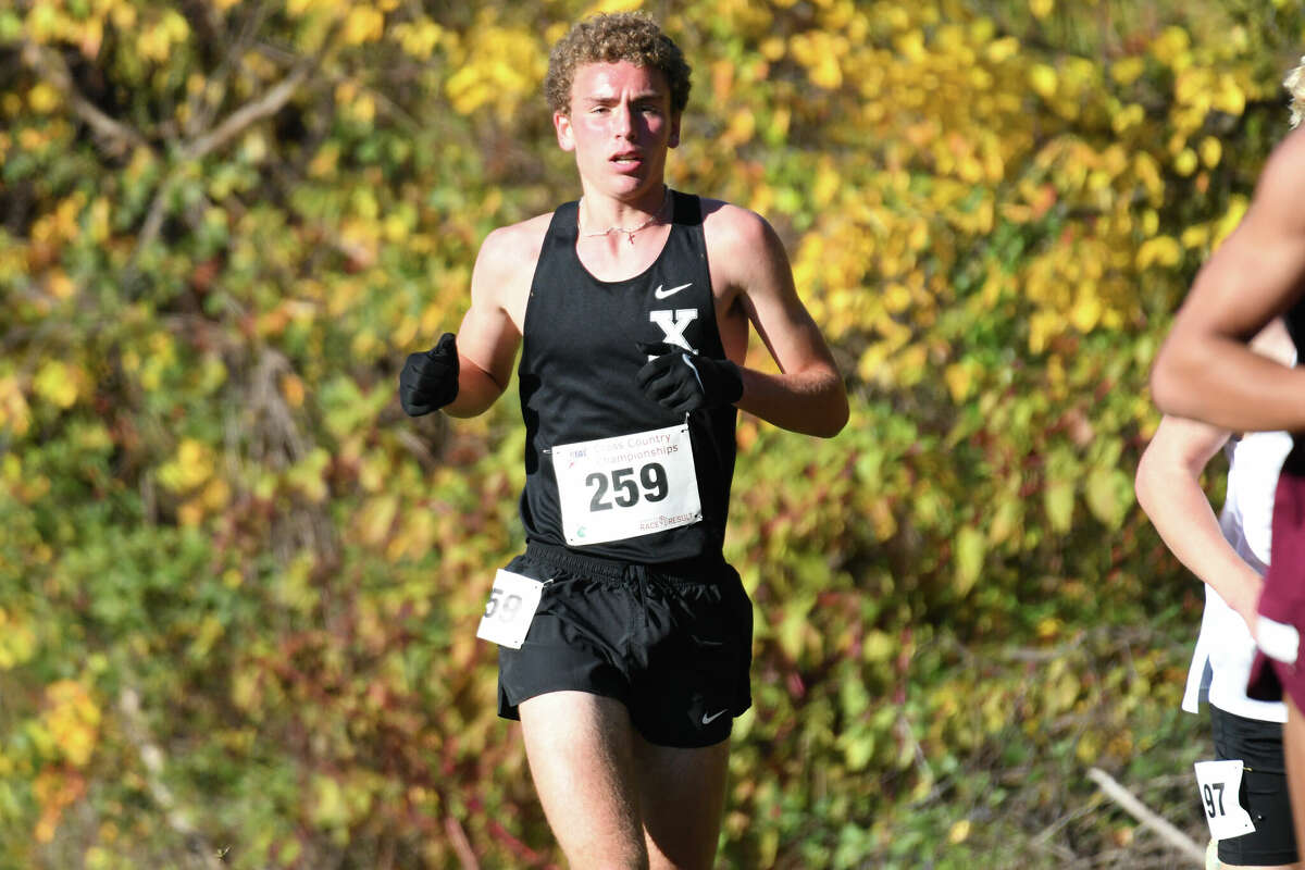 Xavier's Owen Martin competes during the Class L cross country state championship at Wickham Park, Manchester on Saturday, Oct. 29, 2022.