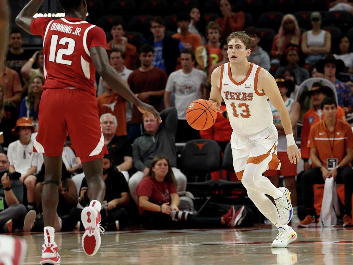 AUSTIN, TEXAS - OCTOBER 29: Gavin Perryman #13 of the Texas Longhorns brings the ball up court during an exhibition game between the Arkansas Razorbacks and the Texas Longhorns at Moody Center on October 29, 2022 in Austin, Texas. (Photo by Chris Covatta/Getty Images)