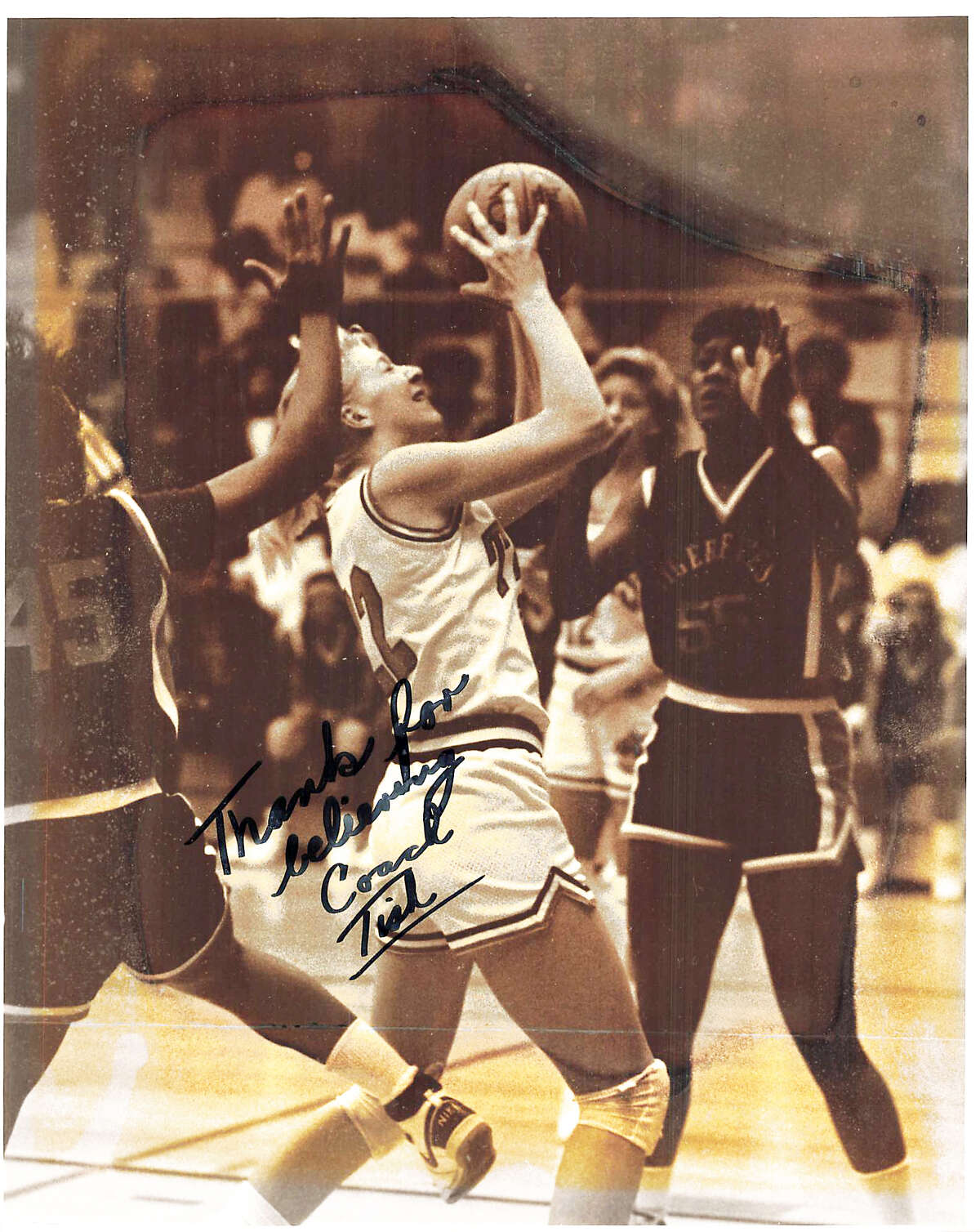 Sarah (Schreiber) Helle, a 1989 Edwardsville High School graduate, drives to the basket during her basketball playing days at EHS. The message on the photo is from her coach, the late Dave Tissier.