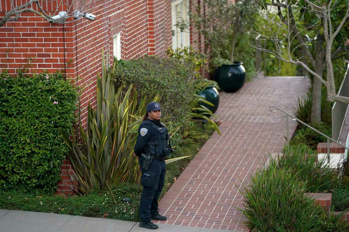 A police officer stands outside the home of House Speaker Nancy Pelosi and Paul Pelosi in San Francisco on Friday, October 28. 