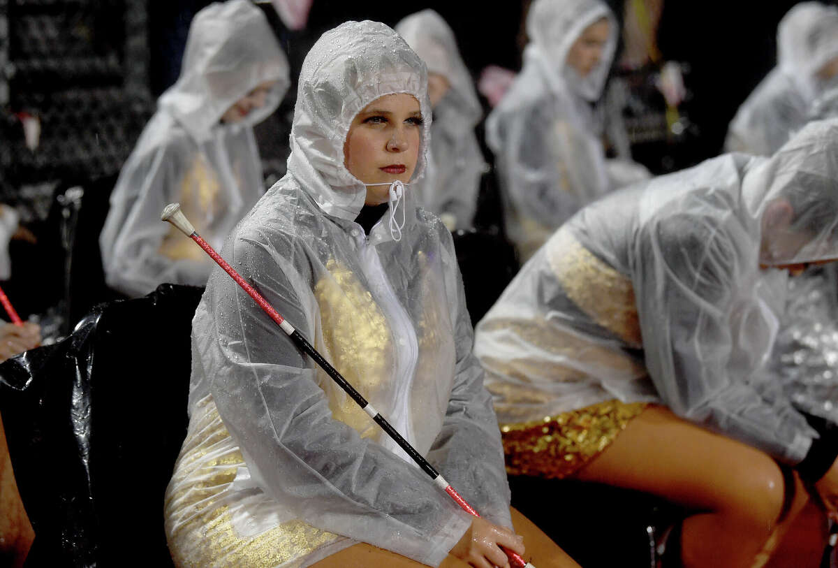 A Nederland twirler weathers the rain. Photo made Friday, October 28, 2022 Kim Brent/Beaumont Enterprise