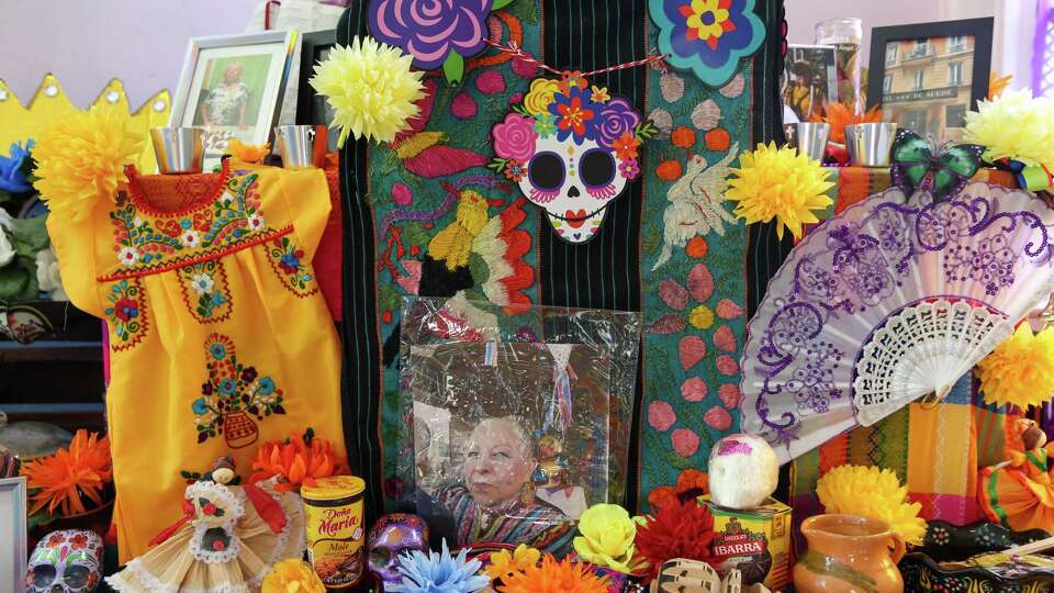 HOUSTON, TX OCT 30: Detail shot of the altar dedicated to Las Damas del Ballet Folkrorico member Alma Robles during the MECA's 22nd Annual Dia De Muertos Festival, which features music and dance performances, vendors, food ,and ofrendas at the Dow School in Houston, Texas.