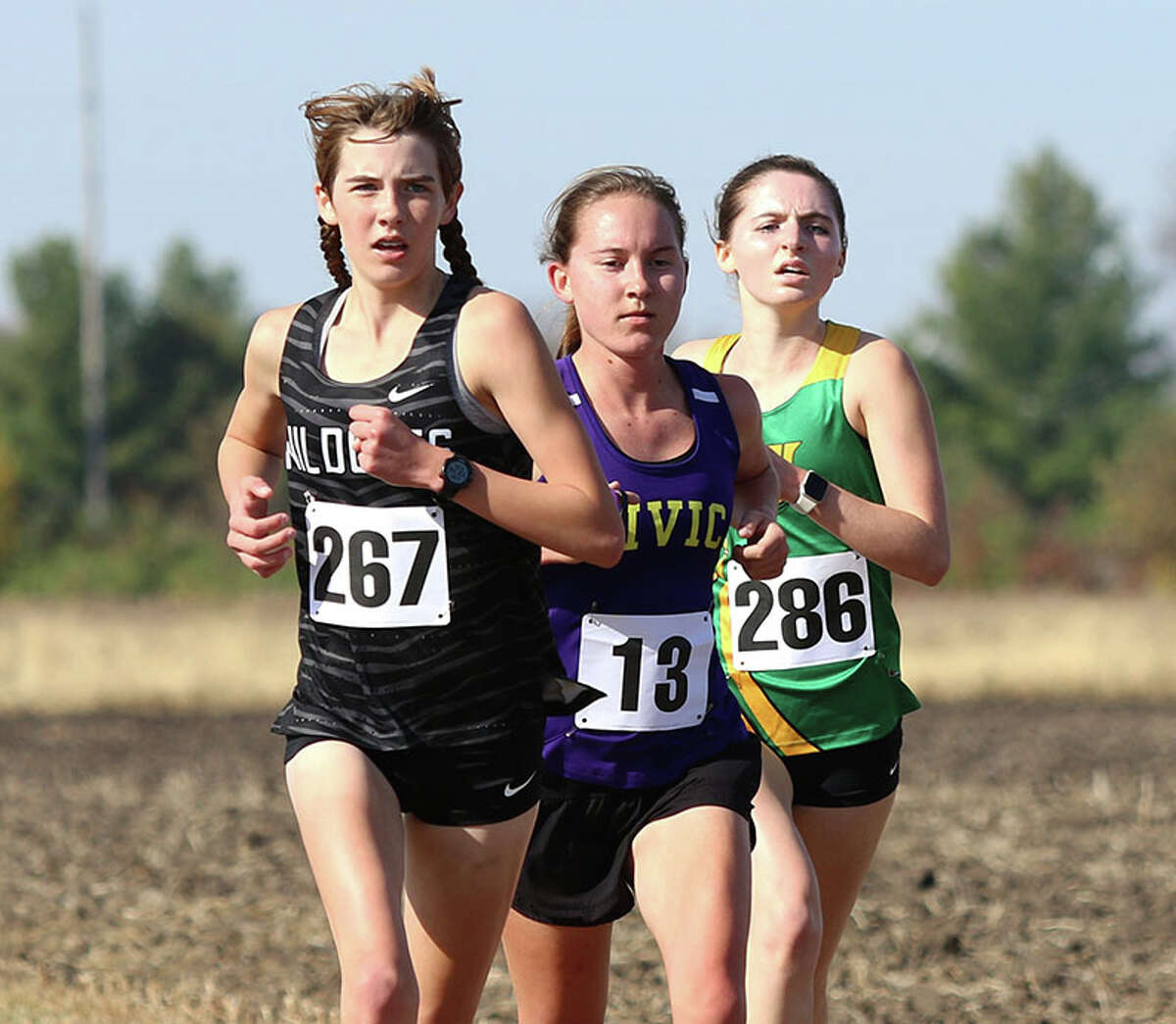 CM's Hannah Meiser settles in between Normal West's Julie Bach (left) and Normal U High's Zoe Carter midway through the Glenwood Class 2A Sectional on Saturday at Chatham. Meiser finished third, with Bach in third and Carter in fifth.