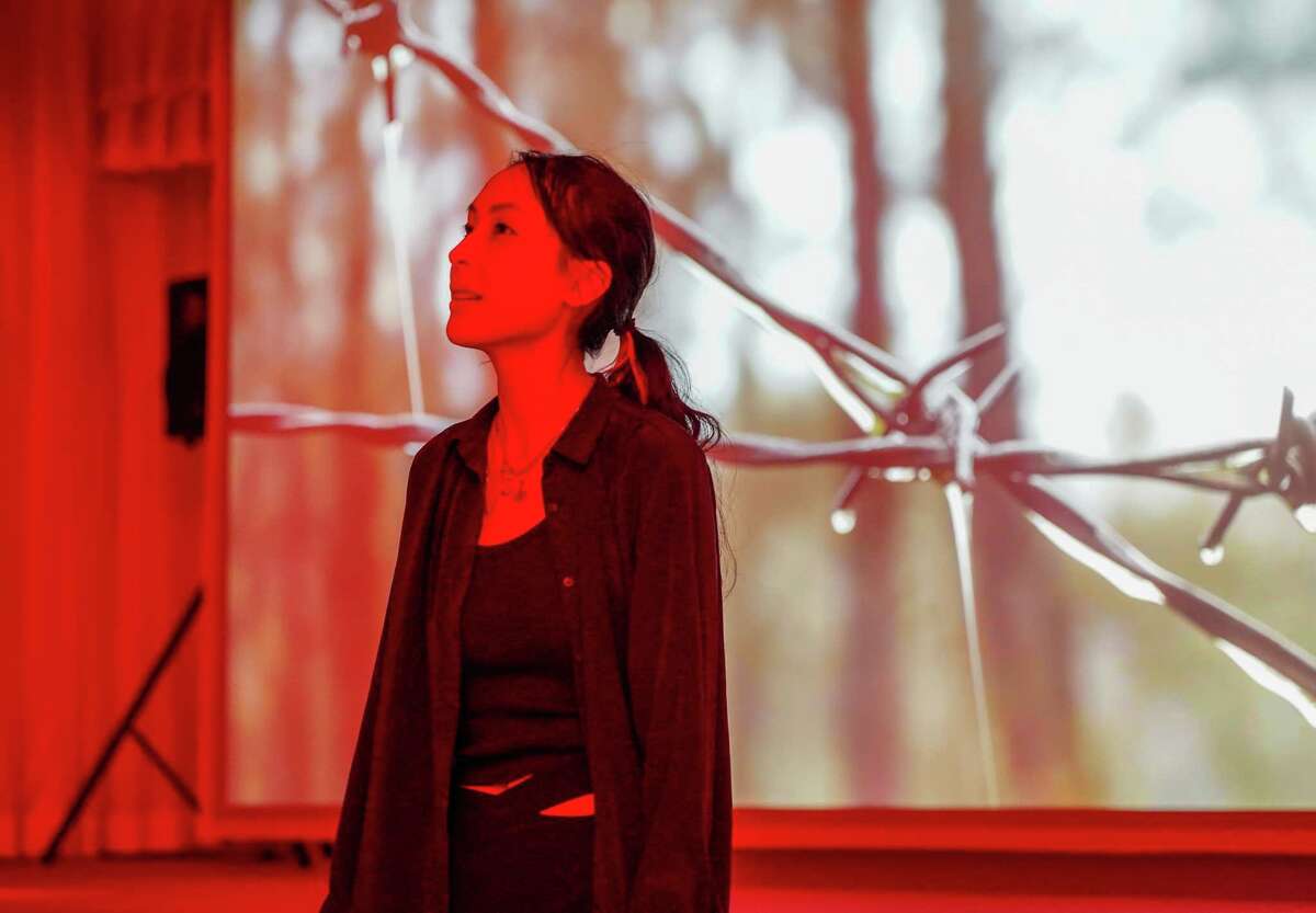 Artist Diane Severin Nguyen speaks in front of her video work “IF REVOLUTION IS A SICKNESS” at the Contemporary Arts Museum Houston on October 27, 2022 in Houston, Texas.