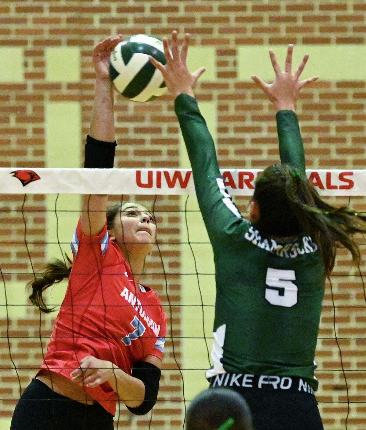 Kalina Calvillo (7) of Antonian spikes the ball as Incarnate Word’s Giana Hilliard (5) attempts to defend during volleyball action at Incarnate Word on Wednesday, Oct. 5, 2022. Antonian won in three sets.