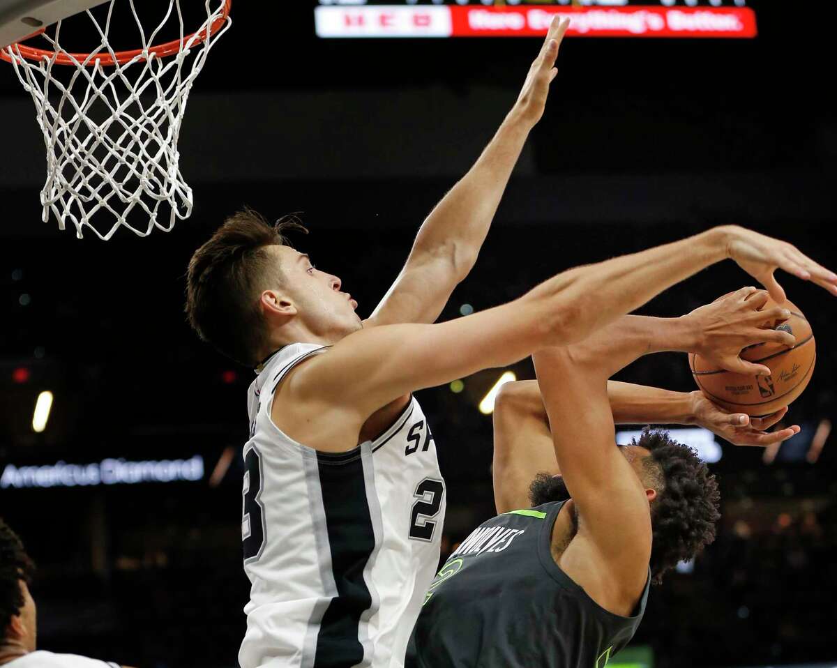San Antonio Spurs Zach Collins (23) blocks shot of Minnesota Timberwolves Karl-Anthony Towns (32) but was called for a foul in the second half on Sunday, Oct. 30, 2022 at the AT&T Center. Spurs defeated the Minnesota Timberwolves 107-98.
