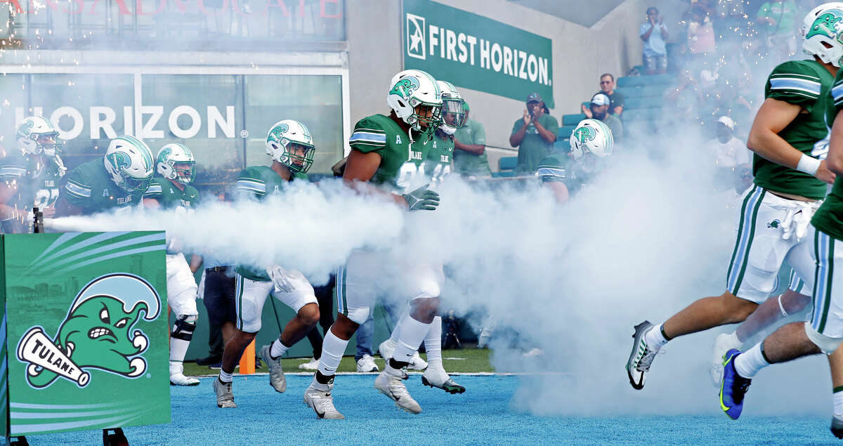 Tulane runs on the field before an NCAA college football game against Memphis in New Orleans, La., Saturday, Oct. 22, 2022. (AP Photo/Tyler Kaufman)