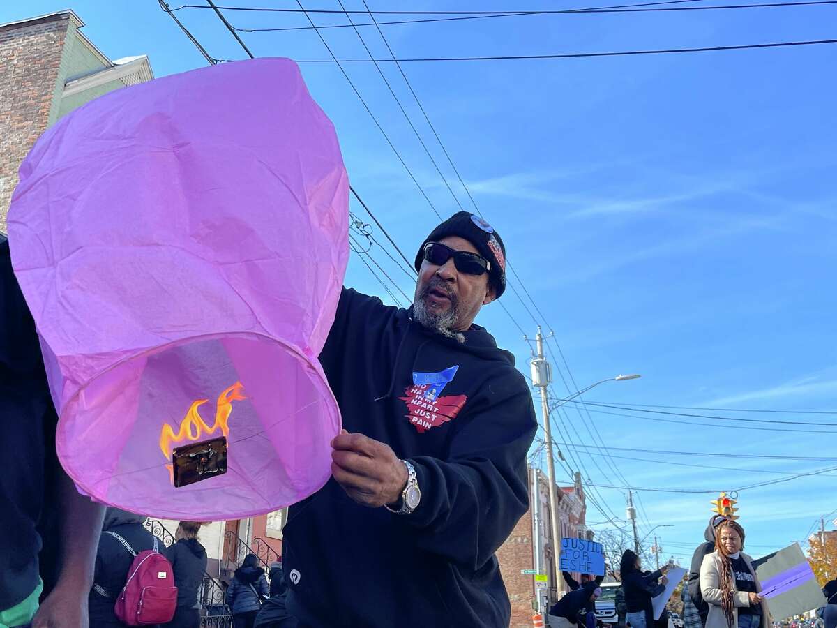Pittsburgh Mosley lights a fire balloon in remembrance of Tanisha Brathwaite on Sunday, Oct. 30, 2022.