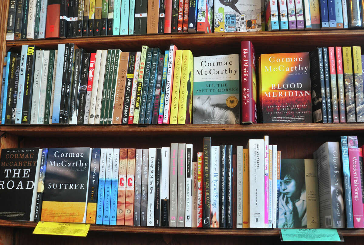 A shelf full of books, including 