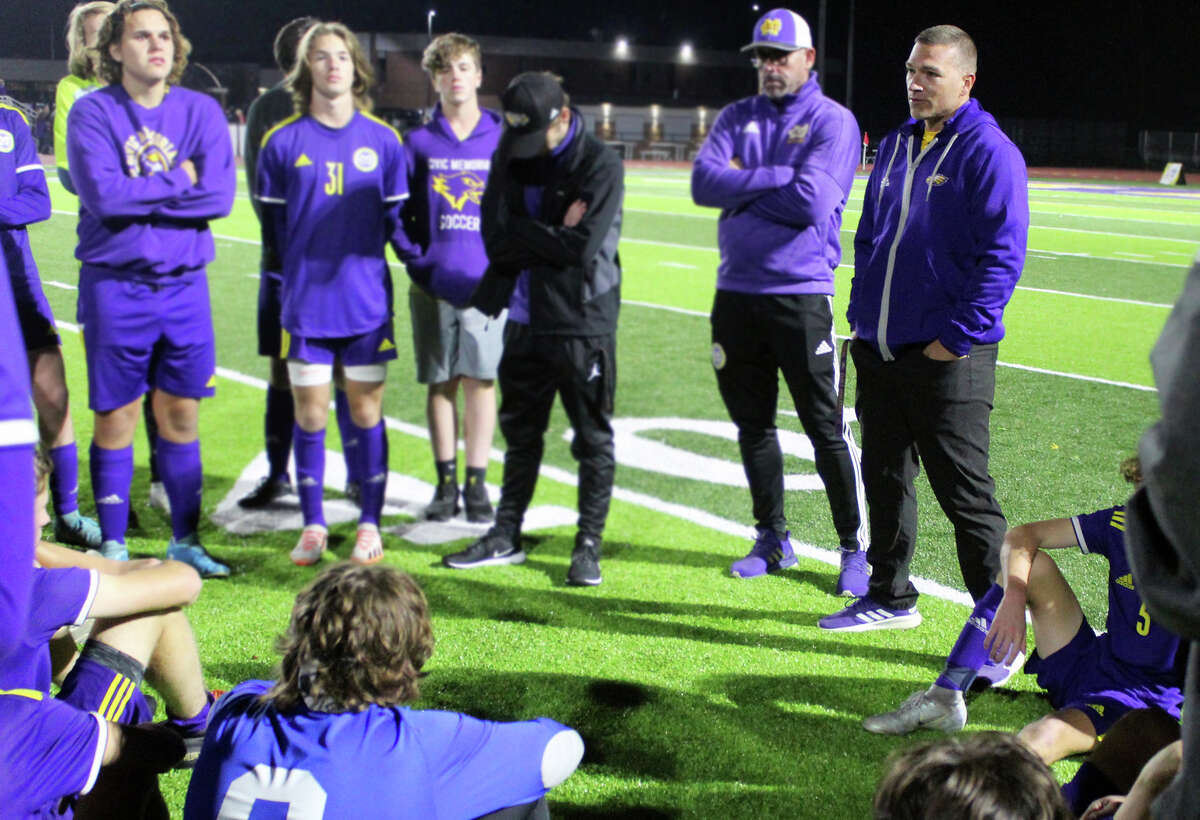 Civic memorial head coach Derek  Jarman, far right, talks to his team following Saturday night's loss to Triad in the championship game of the IHSA Class 2A Bethalto Sectional tournament at Hauser Field. CM finished 24-5, its best record ever.