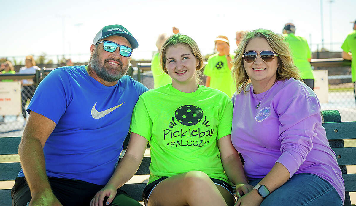 Grace Hassard, center, with her parents Bart and Jerilyn Hassard at the second Pickleball Palooza, Oct. 3 at Plummer Park.