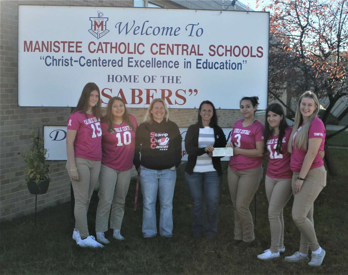 Members of Manistee Catholic Central's volleyball team present on Oct. 27 a $500 check to representatives of the Stomp Out Cancer Fund. Pictured are Regan Leiffers and Ana Watkins, MCC students; Kim Gorley, Stomp Out Cancer Fund vice president; Jill Vasquez, Stomp Out Cancer Fund treasurer; and students Leah Stickney, Rianna Leiffers and Emily Miller.
