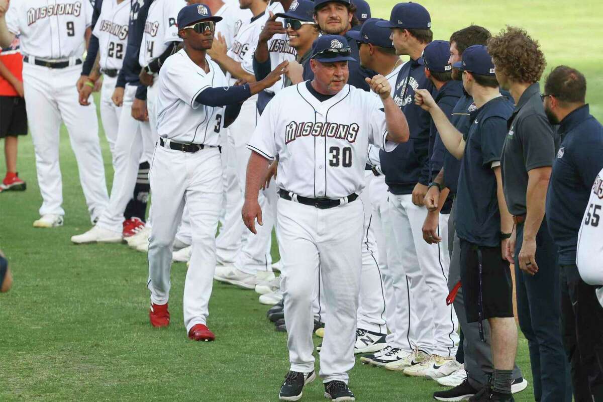 San Antonio Missions' manager Phillip Wellman (30) greets his team at their home opener against the Frisco RoughRiders at Nelson W. Wolff Municipal Stadium on Apr. 12, 2022.