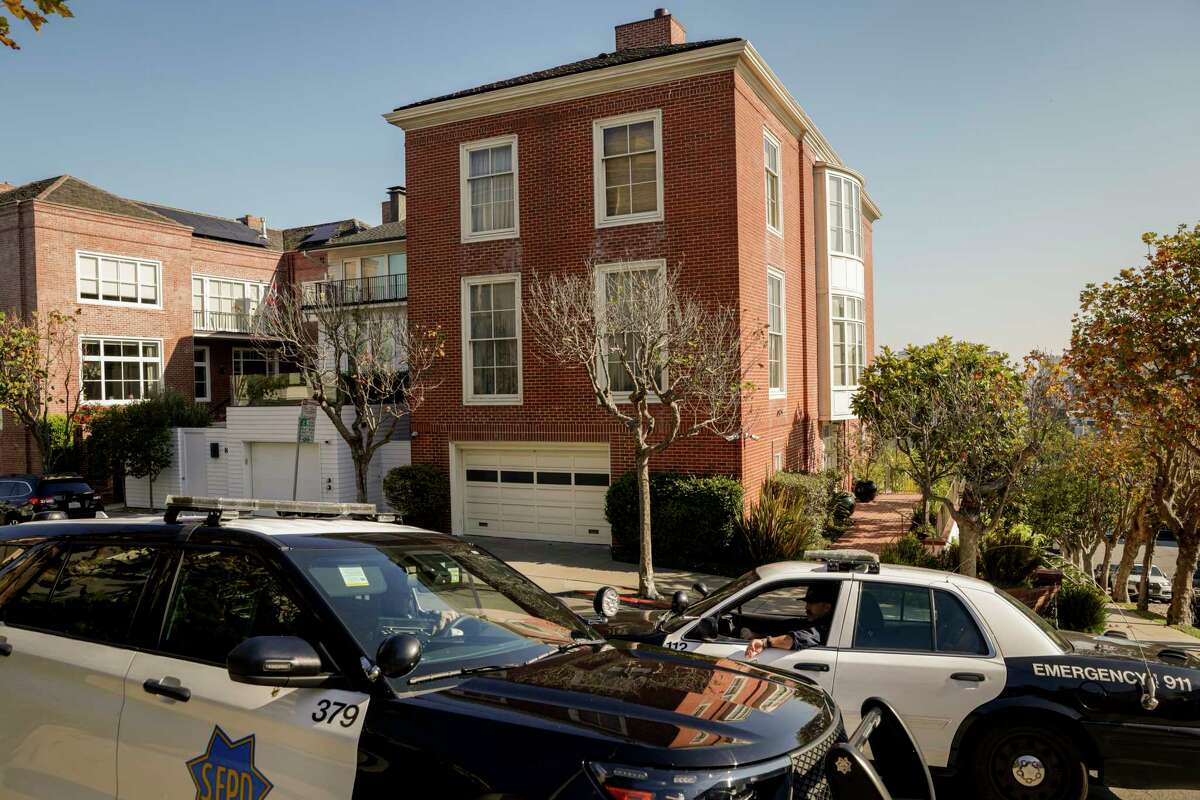 Police officers are stationed outside the Pelosi home Sunday in San Francisco where House Speaker Nancy Pelosi’s husband, Paul Pelosi was attacked.