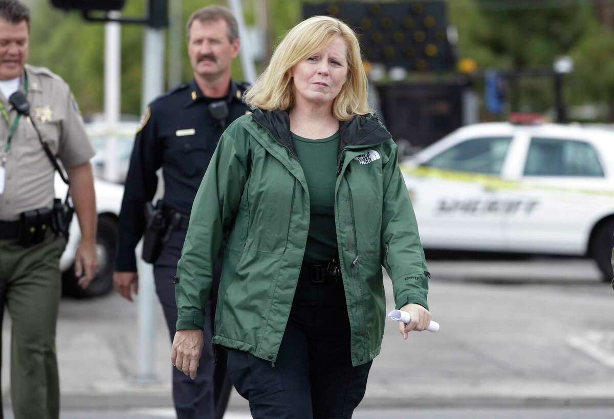 FILE - Santa Clara County Sheriff Laurie Smith walks to a news conference in Cupertino, Calif., Wednesday, Oct. 5, 2011. (AP Photo/Paul Sakuma, File)