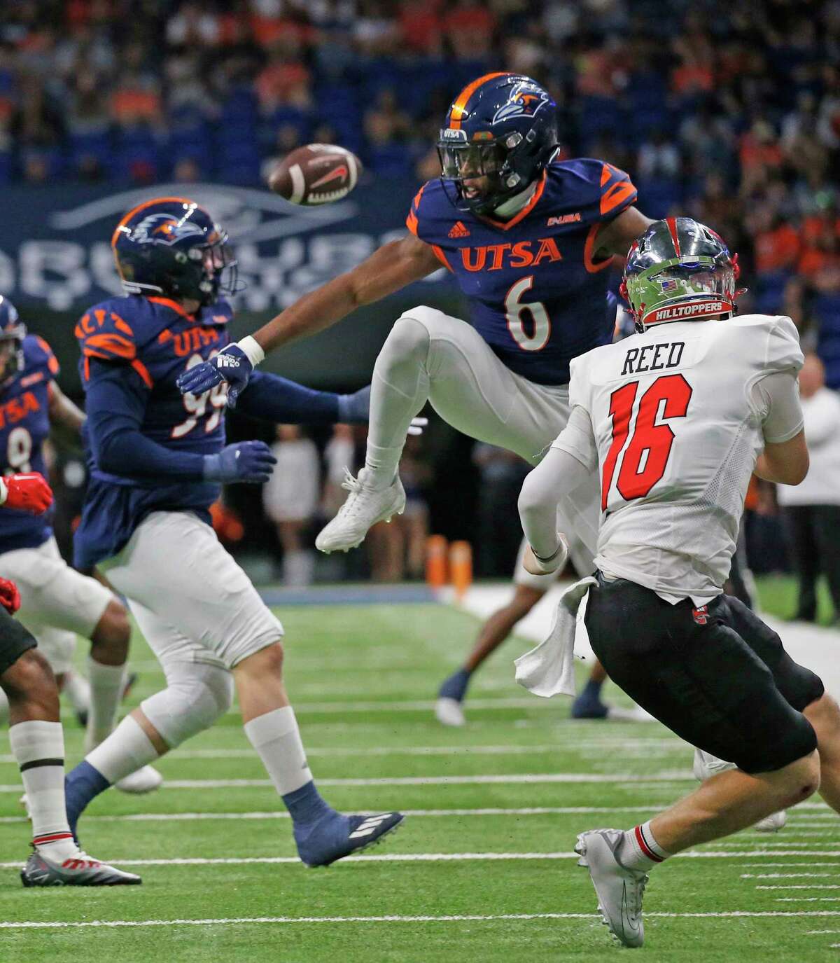 SAN ANTONIO, TX - OCTOBER 08: Safety Kelechi Nwachuku #6 of the UTSA Roadrunners prevents Austin Reed #16 of the Western Kentucky Hilltoppers from competing a pass at the Alamodome on October 08, 2022 in San Antonio, Texas. (Photo by Ronald Cortes/Getty Images)
