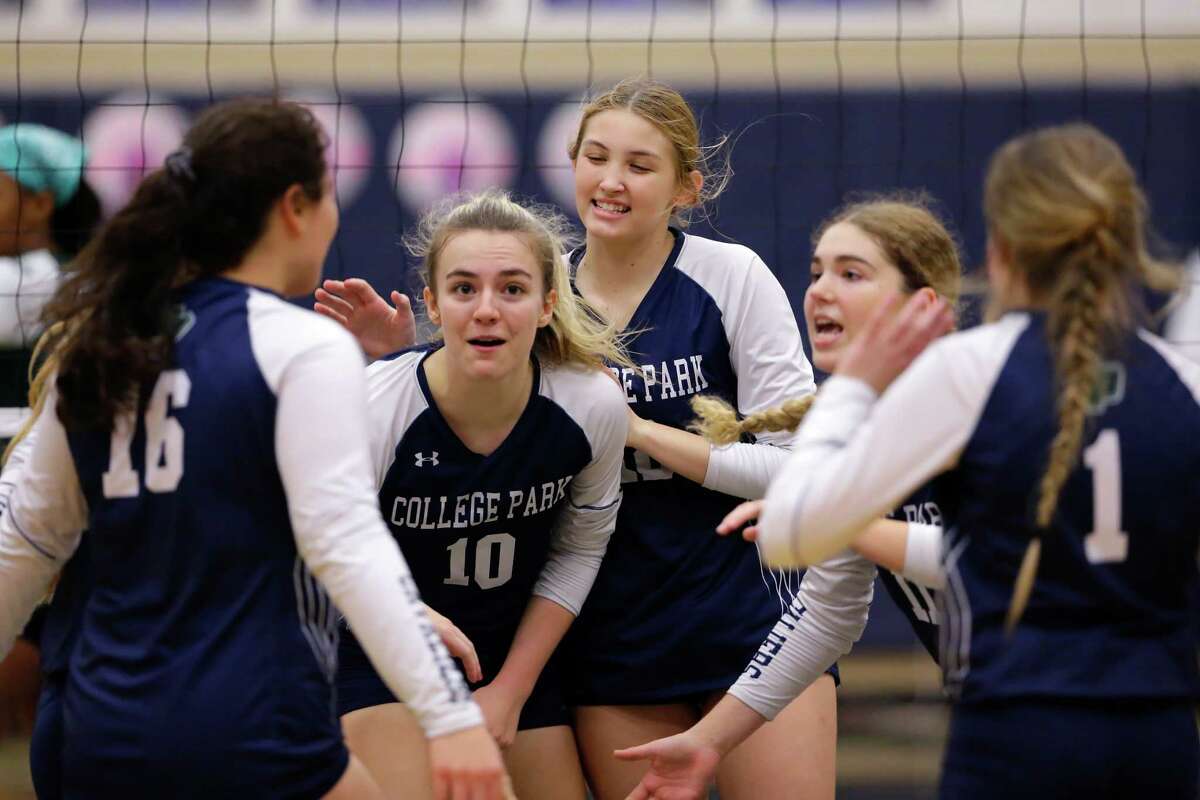 College Park players celebrate a point against Spring during their Region II-6A bi-district volleyball match at College Park High School Tuesday, Nov. 1, 2022 in The Woodlands, TX.