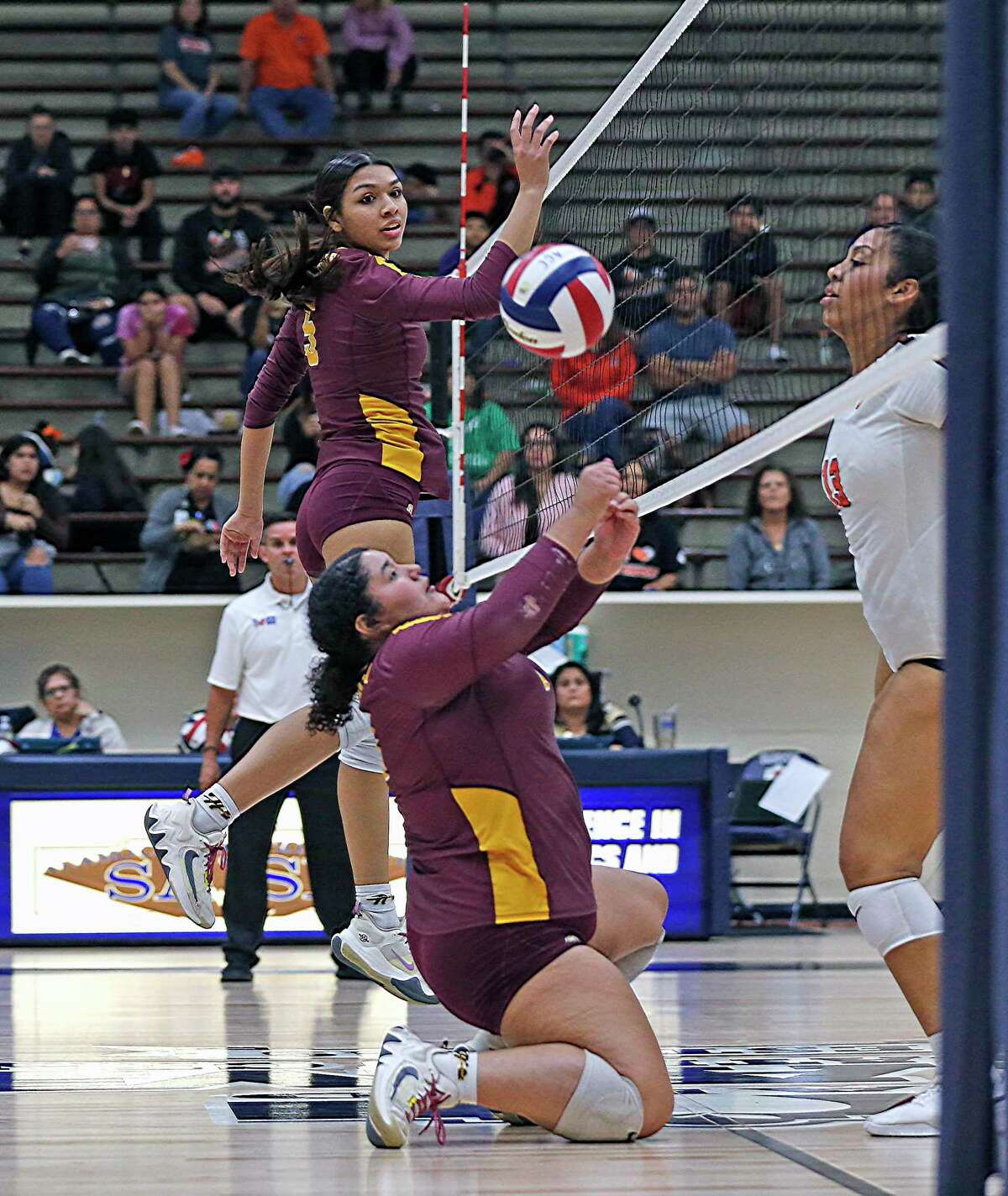 Harlandale Cayla Reyes #16 makes a save against Burbank in a long point in the third game in a first-round volleyball playoff on Tuesday, Nov.1, 2022 at Alamo Convocation Center. Harlandale defeated Burbank 3-0.