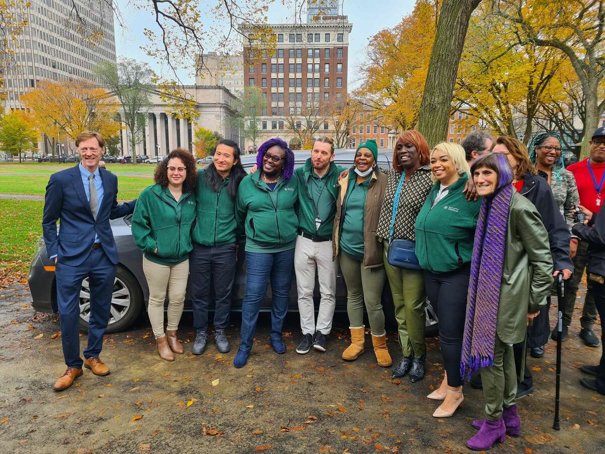 Mayor Justin Elicker and U.S. Rep. Rosa DeLauro, D-3, with Elm City COMPASS team staffers Nov. 1, 2022 in New Haven.