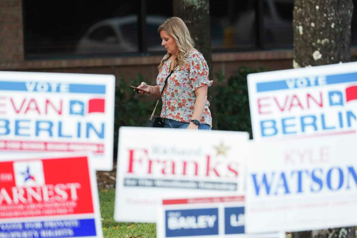 A voter leaves the South Montgomery County Community Center after casting her ballot as a part of early voting, Wednesday, Nov. 2, 2022, in The Woodlands. More than 140,000 Montgomery County residents cast early ballots for Tuesday's election, setting a record for midterm early voting. 