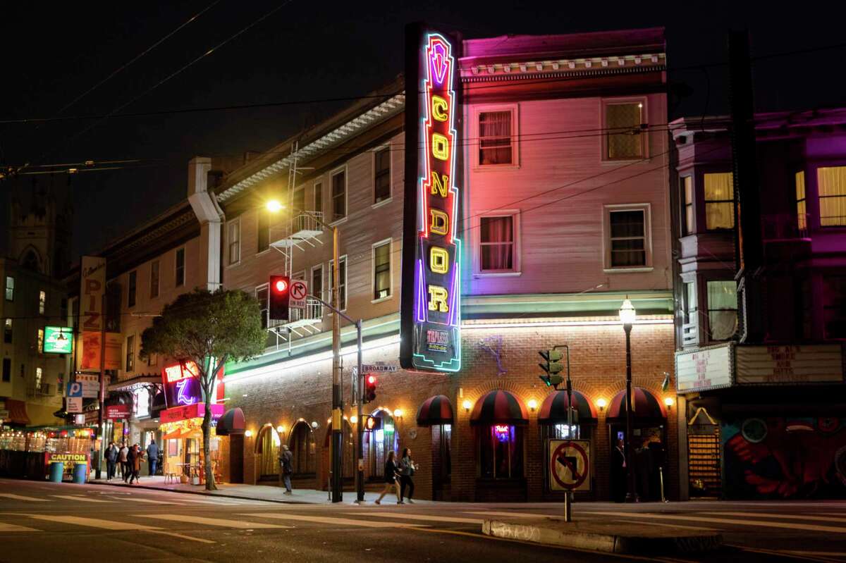 The Condor Club is seen along Columbus Avenue in the North Beach neighborhood of San Francisco, Calif. Wednesday, May 12, 2021. The Condor Club, San Francisco's first topless bar, is a staple of the city and North Beach's adult entertainment scene. It's coming back as one of the last clubs of its kind and a business that, during the pandemic, few have thought much about. Though almost all the other strip clubs in the city have opened up, or closed forever, the Condor has taken its time, and hosted a soft opening to the public at 25% capacity on Wednesday, May 12.