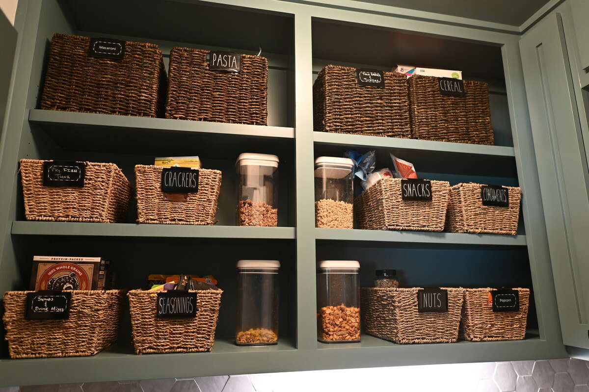 Even the pantry is a showplace, with hand-labeled baskets holding crackers, tuna, macaroni and other foodstuffs neatly lined up side by side.