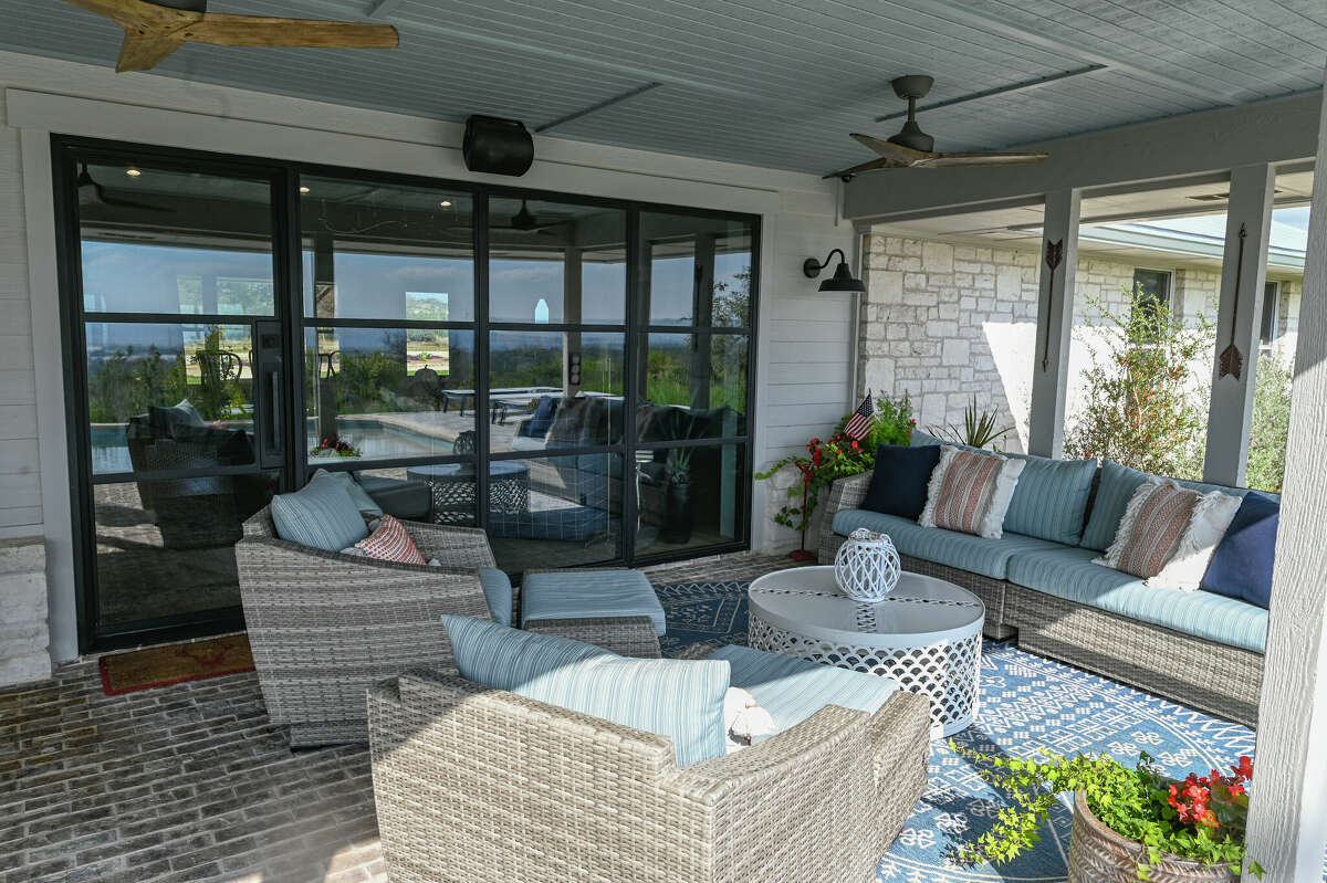 The back patio has several seating areas under a 12-foot-deep covered porch.