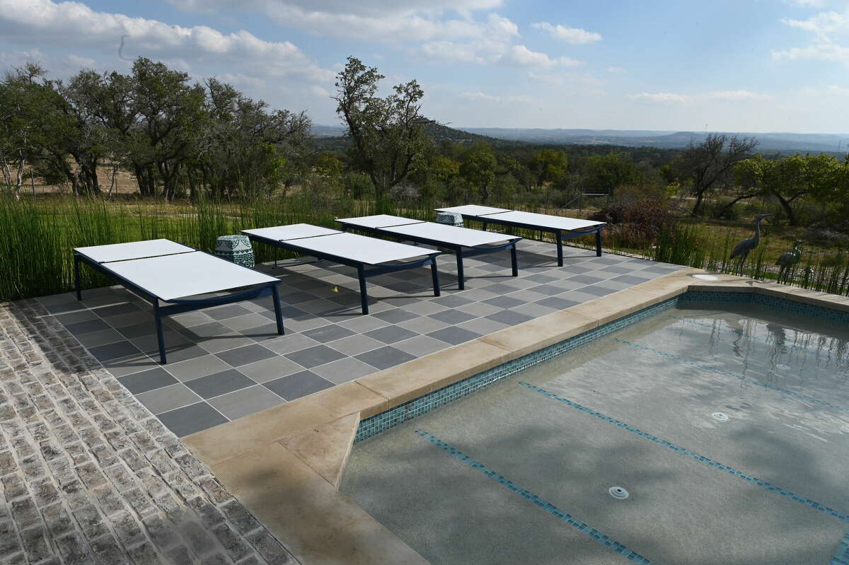 The back patio has a built-in swimming pool with a tanning ledge.