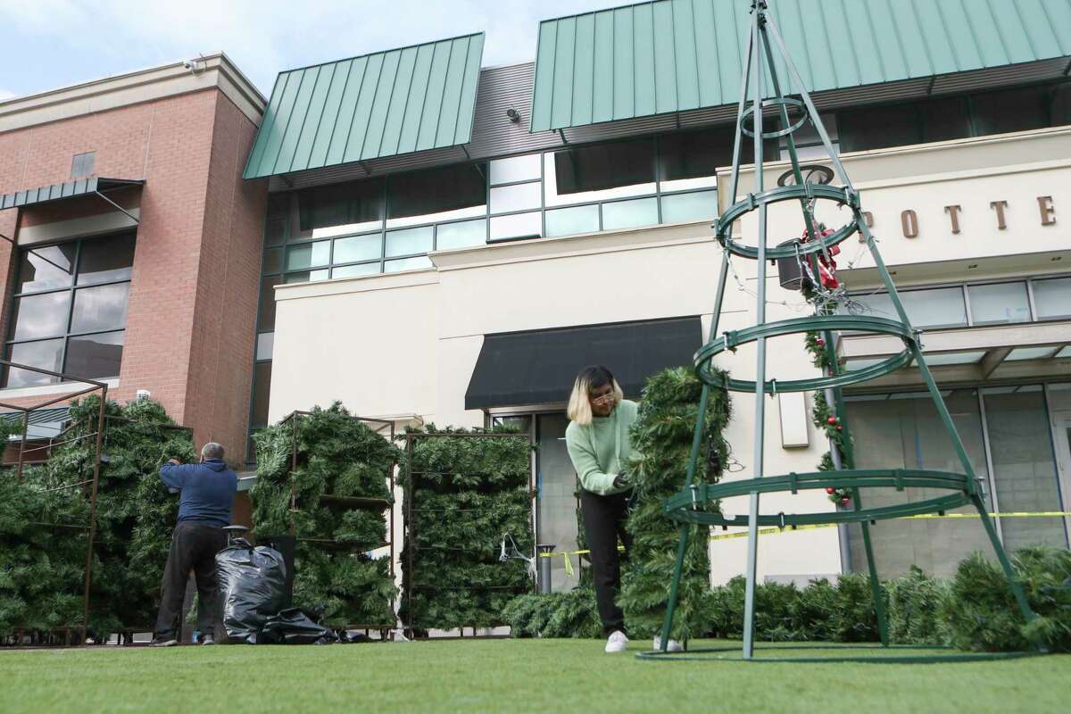 A crew of 10 set up The Woodlands Mall’s annual 65-foot Christmas tree in the mall’s green space over the course of the day on Wednesday, Nov. 2, 2022, in The Woodlands.